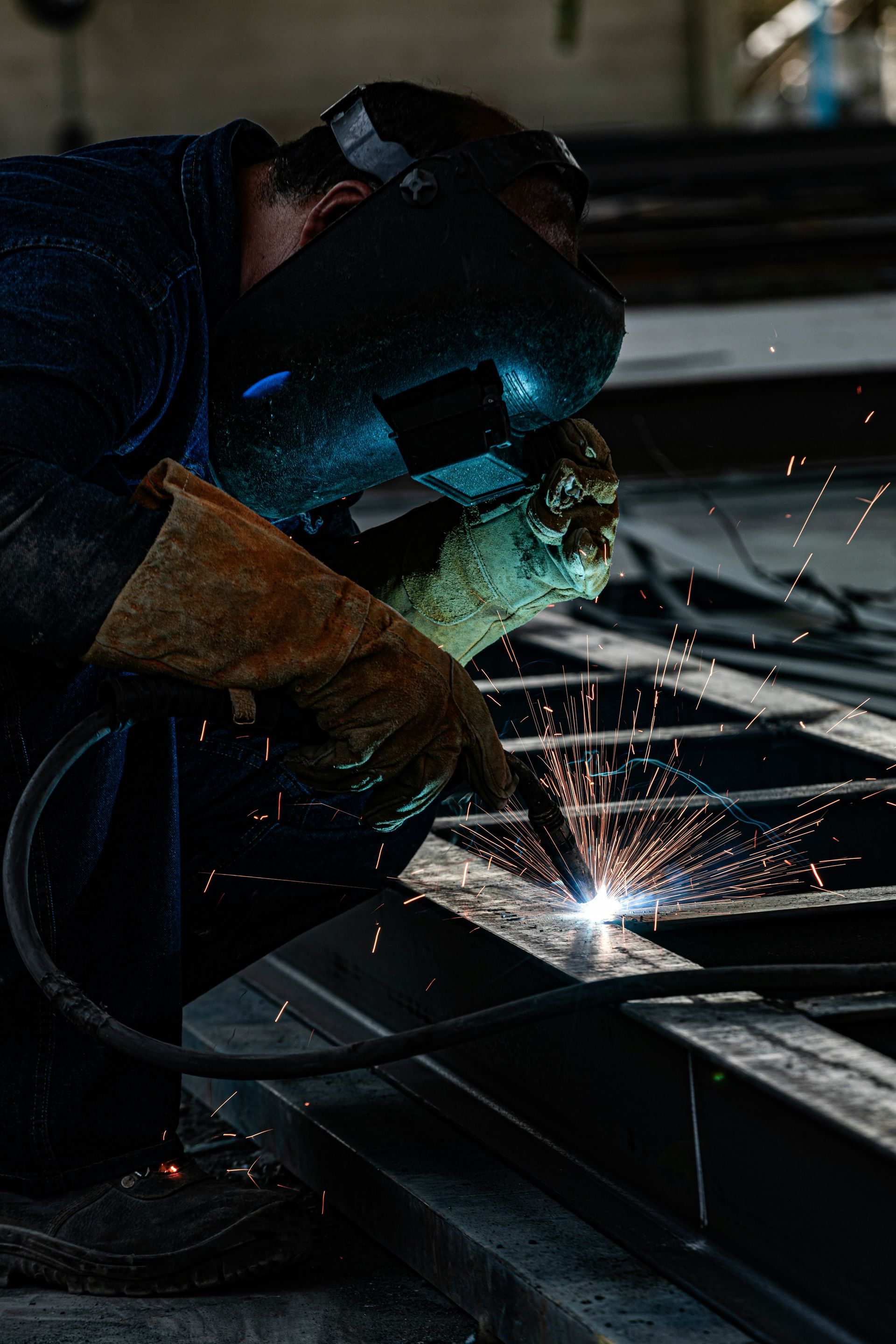 a welder working on a piece of metal